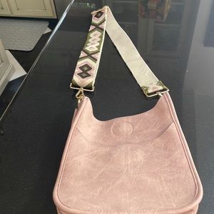 Perfect condition, never used, cross body bag with guitar strap.